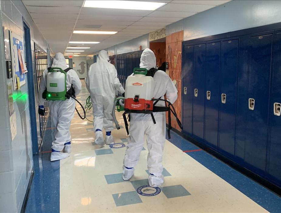 Are those Ghost Busters? Image of group of technicians in PPE.